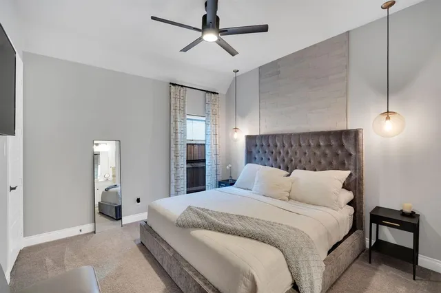 a bedroom with bed and window