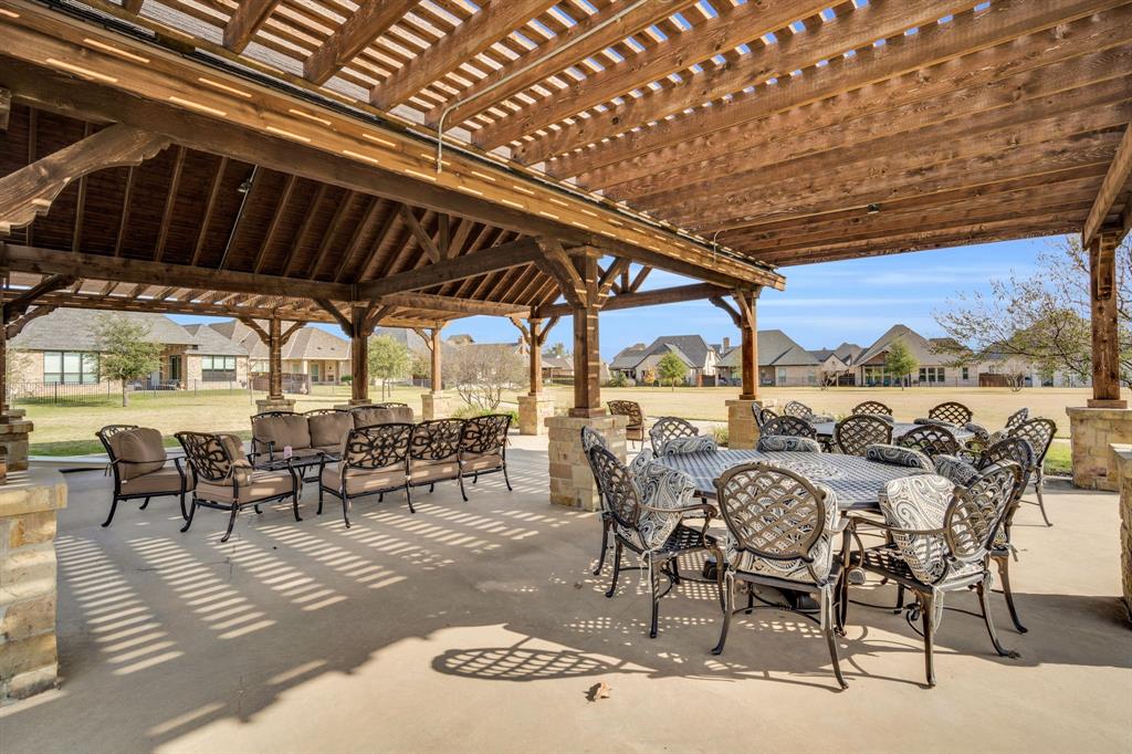 2221 Meridian Place Midlothian, TX 76065 - Photo 35 of 39 a view of a patio with table and chairs and potted plants