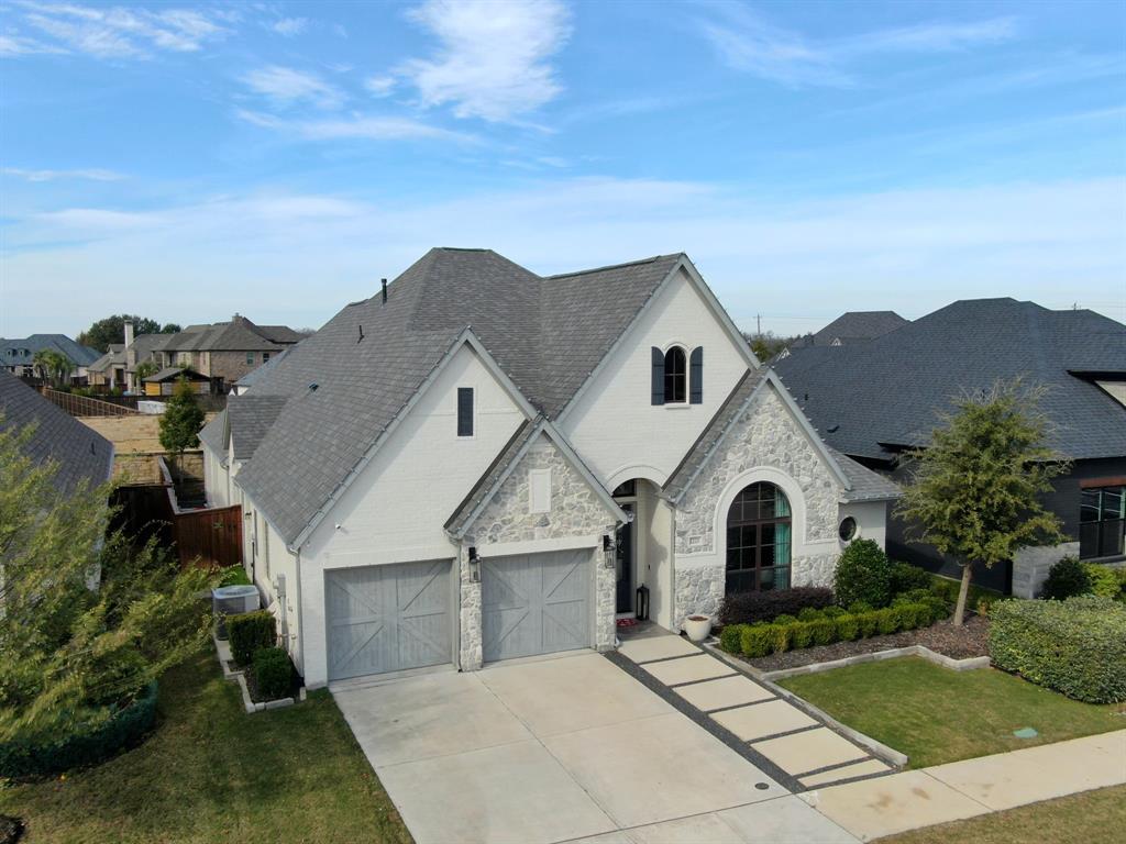 2221 Meridian Place Midlothian, TX 76065 - Photo 38 of 39 a view of a white house with a yard plants and large tree