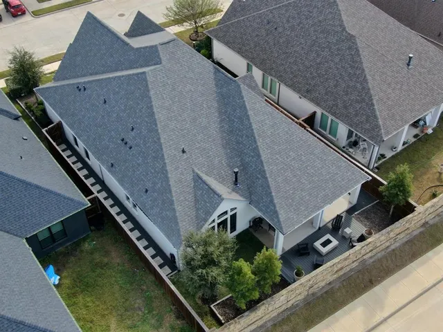 an aerial view of house with pool