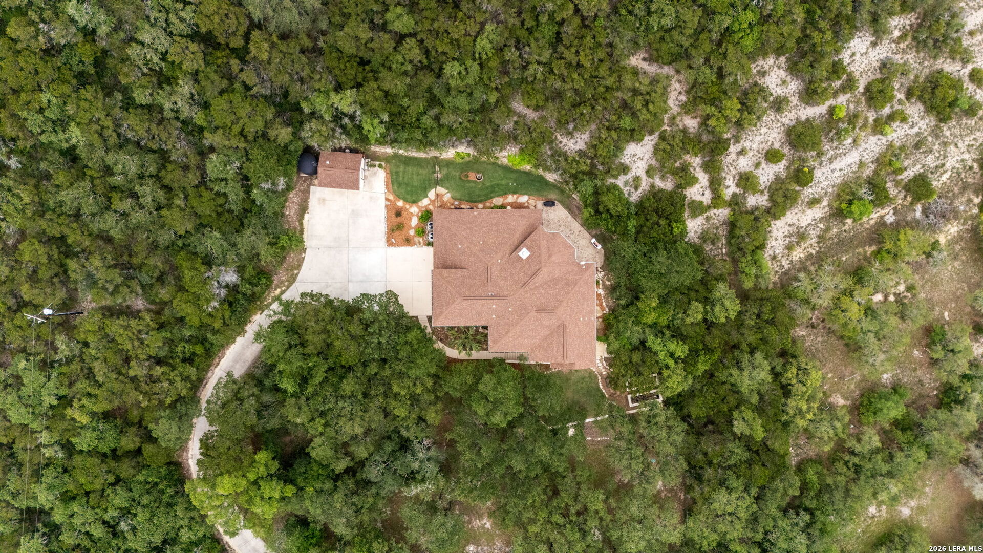 17431 Helotes Spring Road Helotes, TX 78023 - Photo 48 of 50 an aerial view of a house with a yard and garden