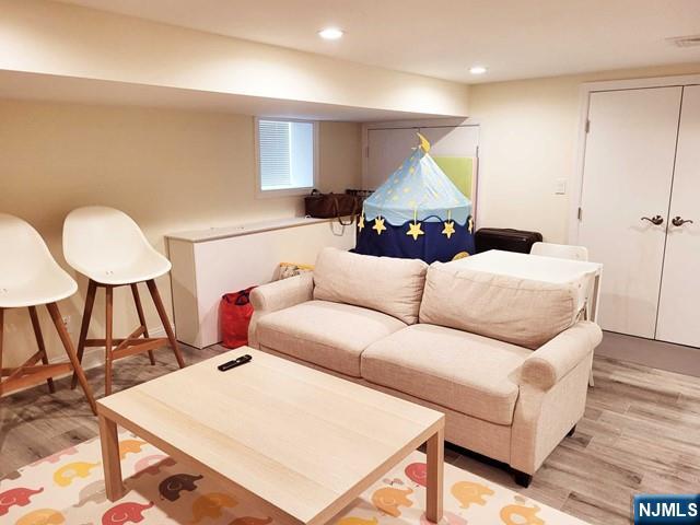 296 County Road, Unit 1 Tenafly, NJ 07670 - Photo 12 of 16 a living room with furniture and a wooden floor