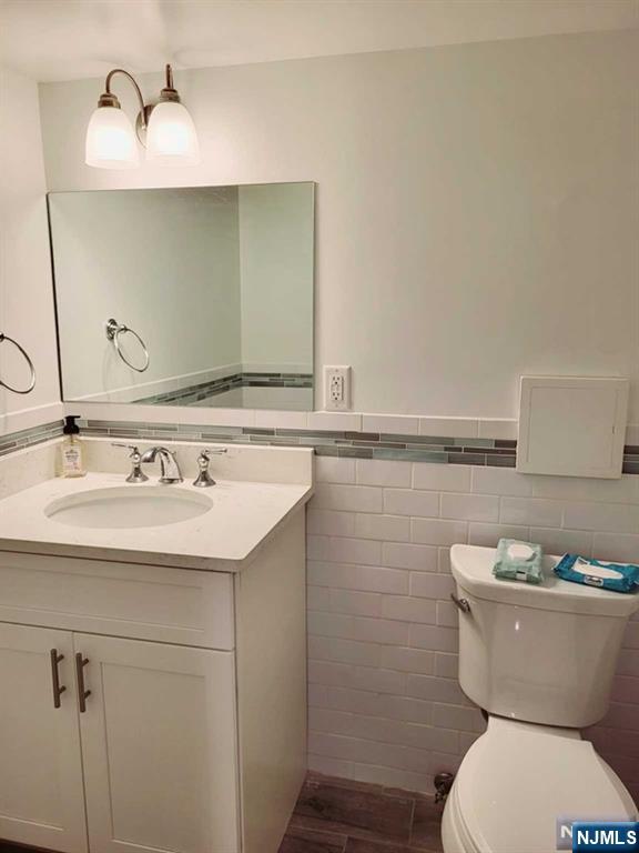 296 County Road, Unit 1 Tenafly, NJ 07670 - Photo 13 of 16 a bathroom with a sink and a toilet