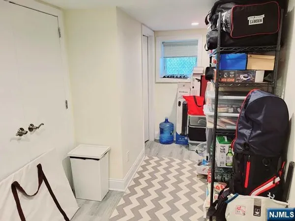 a bedroom with a bed and cabinets