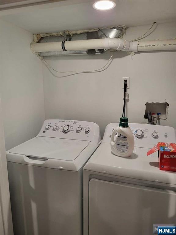 296 County Road, Unit 1 Tenafly, NJ 07670 - Photo 15 of 16 a utility room with dryer and washer