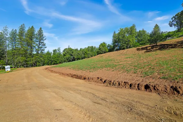 a view of a road with a yard