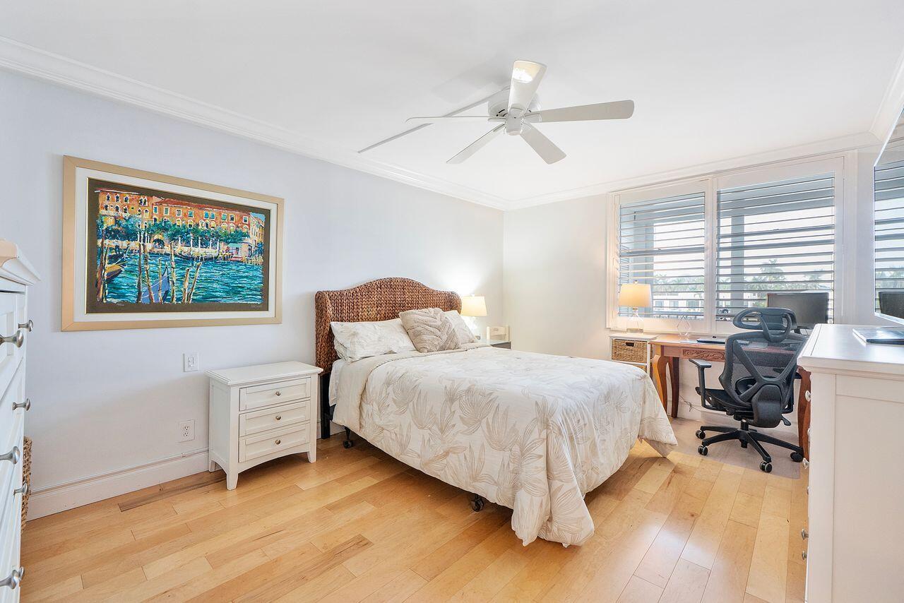 3310 South Ocean Boulevard, Unit 231D Highland Beach, FL 33487 - Photo 13 of 31 a bedroom with a bed and a table