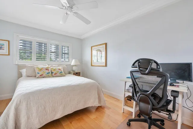 a bedroom with a bed and a chair