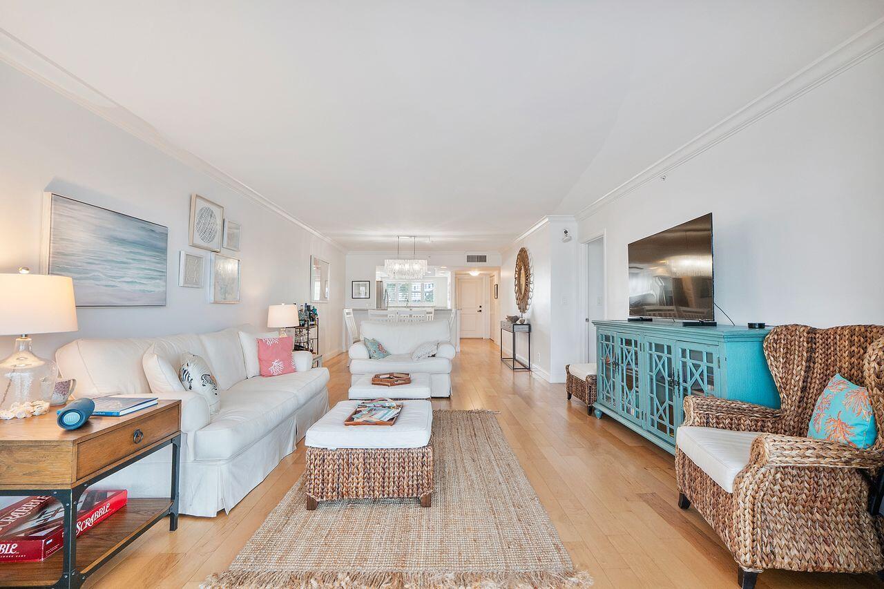 3310 South Ocean Boulevard, Unit 231D Highland Beach, FL 33487 - Photo 8 of 31 a living room with furniture and a flat screen tv
