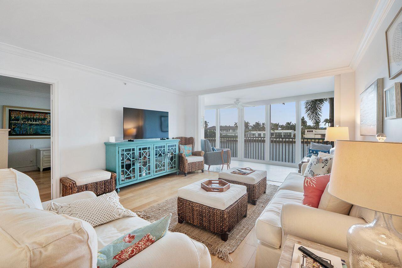 3310 South Ocean Boulevard, Unit 231D Highland Beach, FL 33487 - Photo 10 of 31 a living room with furniture and a large window