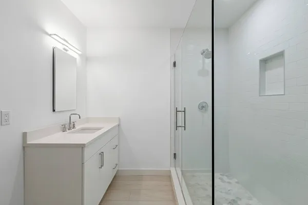 a bathroom with a sink and a mirror