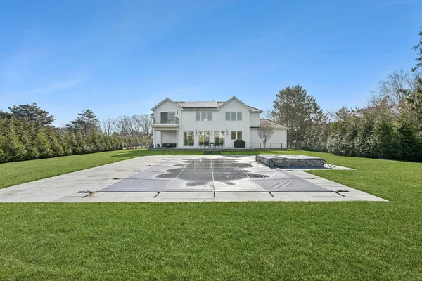 a living room with furniture and stairs