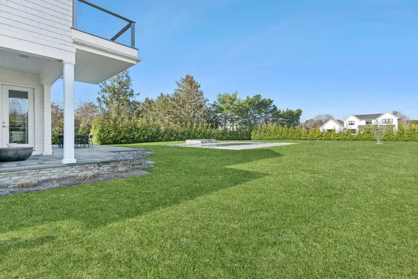 a bedroom with a large bed and a large window
