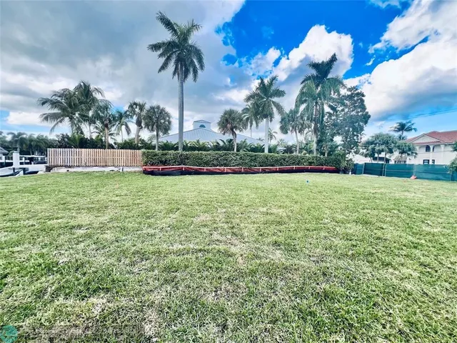 a view of a swimming pool and trees in the background