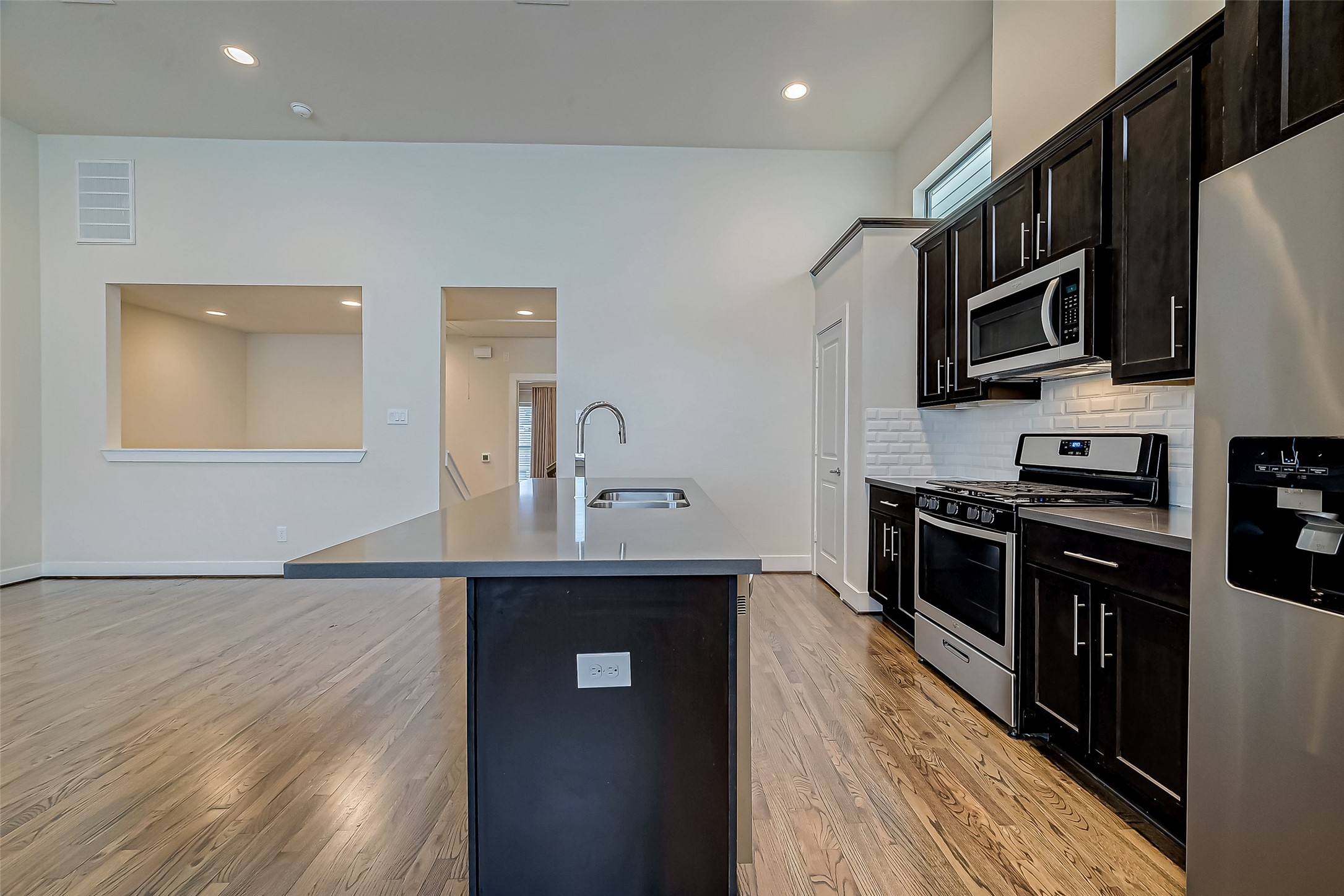 4025 Tulane Street Houston, TX 77018 - Photo 11 of 43 a kitchen with stainless steel appliances a sink dishwasher stove top oven and refrigerator