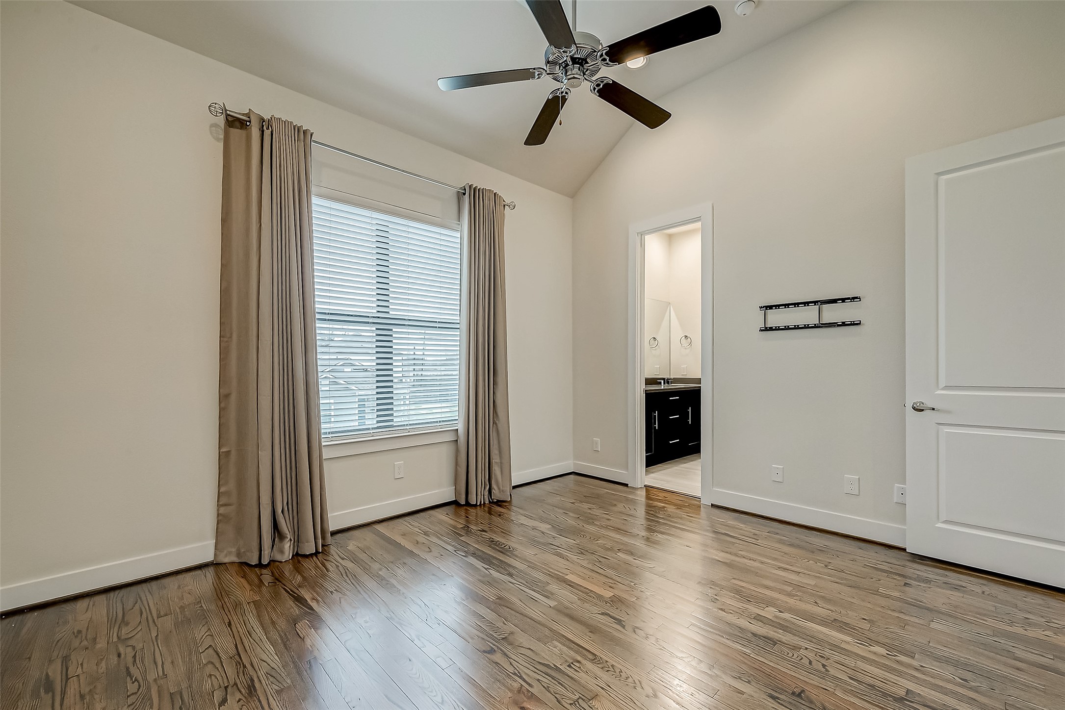 4025 Tulane Street Houston, TX 77018 - Photo 17 of 43 wooden floor in an empty room with a window