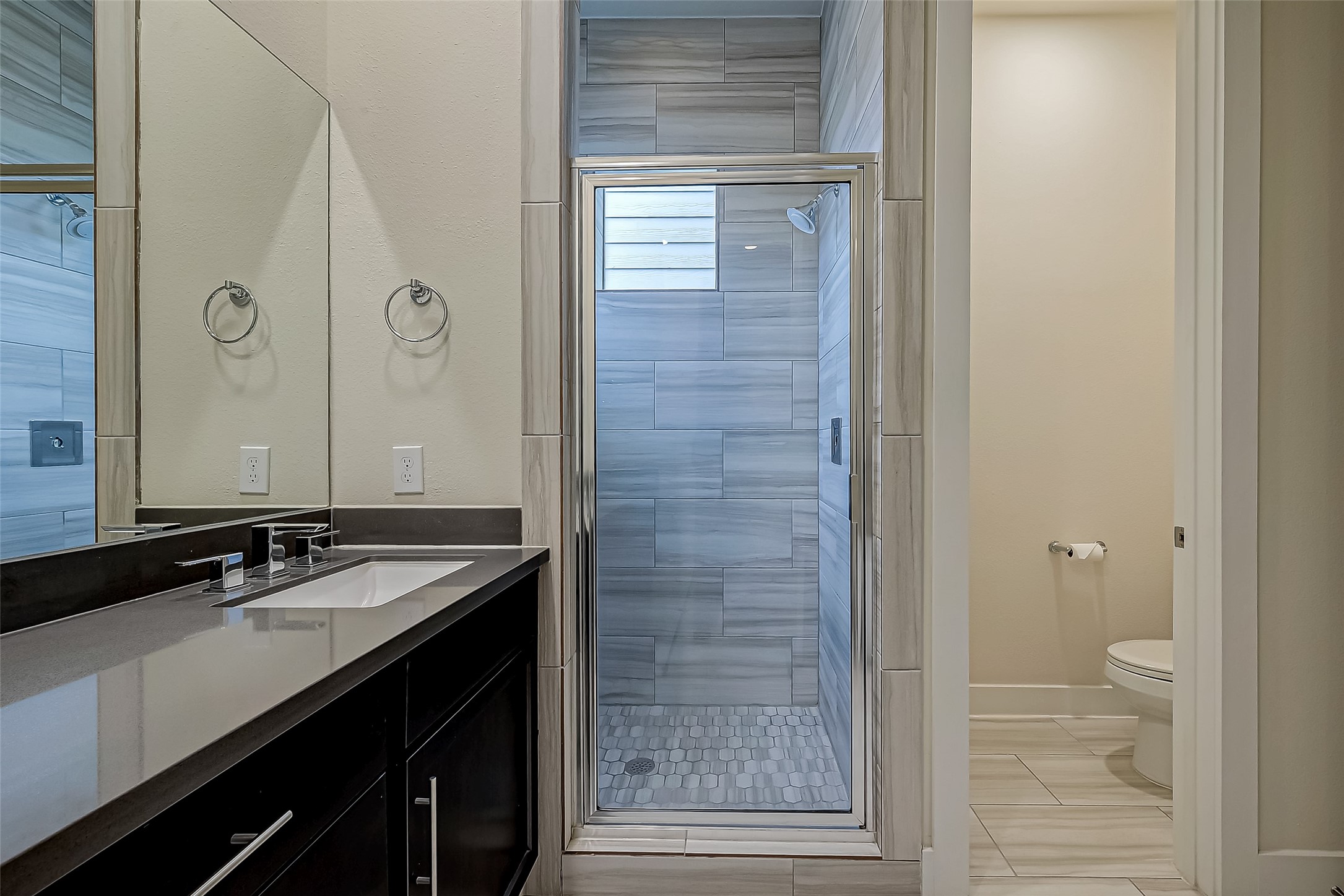4025 Tulane Street Houston, TX 77018 - Photo 20 of 43 a bathroom with a sink a toilet and shower
