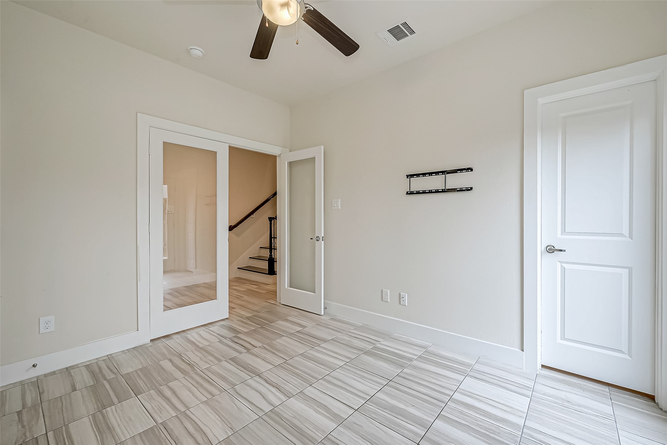 4025 Tulane Street Houston, TX 77018 - Photo 28 of 43 a view of empty room with wooden floor and ceiling fan