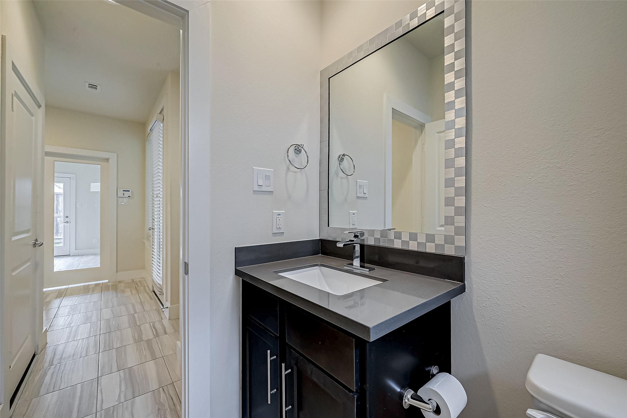 4025 Tulane Street Houston, TX 77018 - Photo 31 of 43 a bathroom with a sink and a mirror