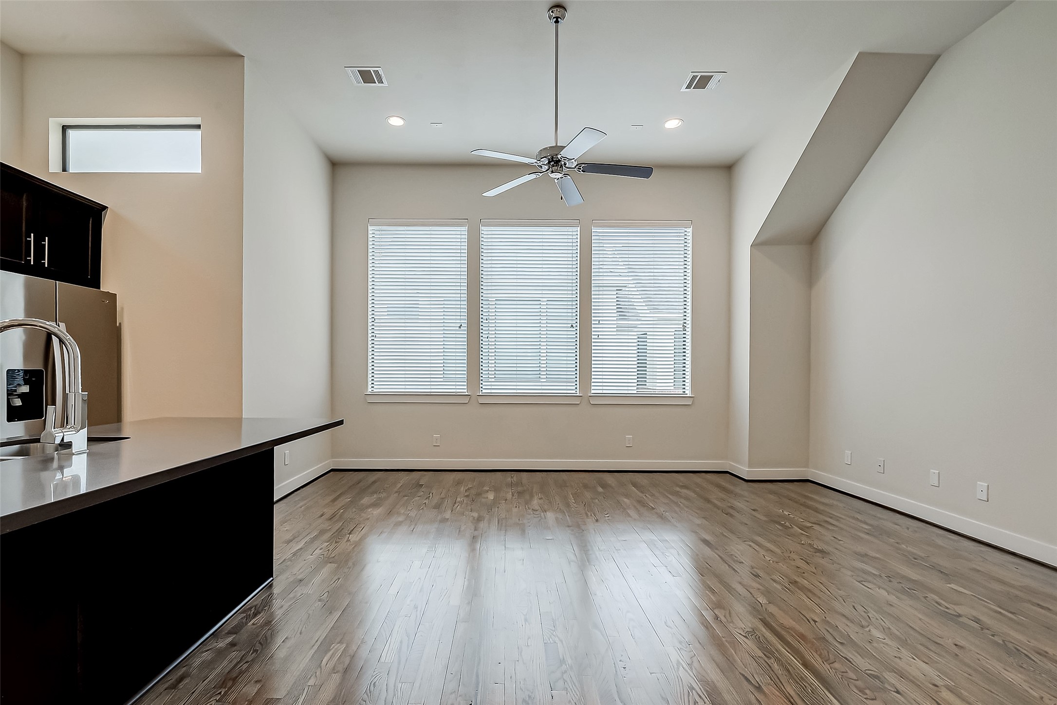 4025 Tulane Street Houston, TX 77018 - Photo 9 of 43 a view of an empty room with a window and wooden floor