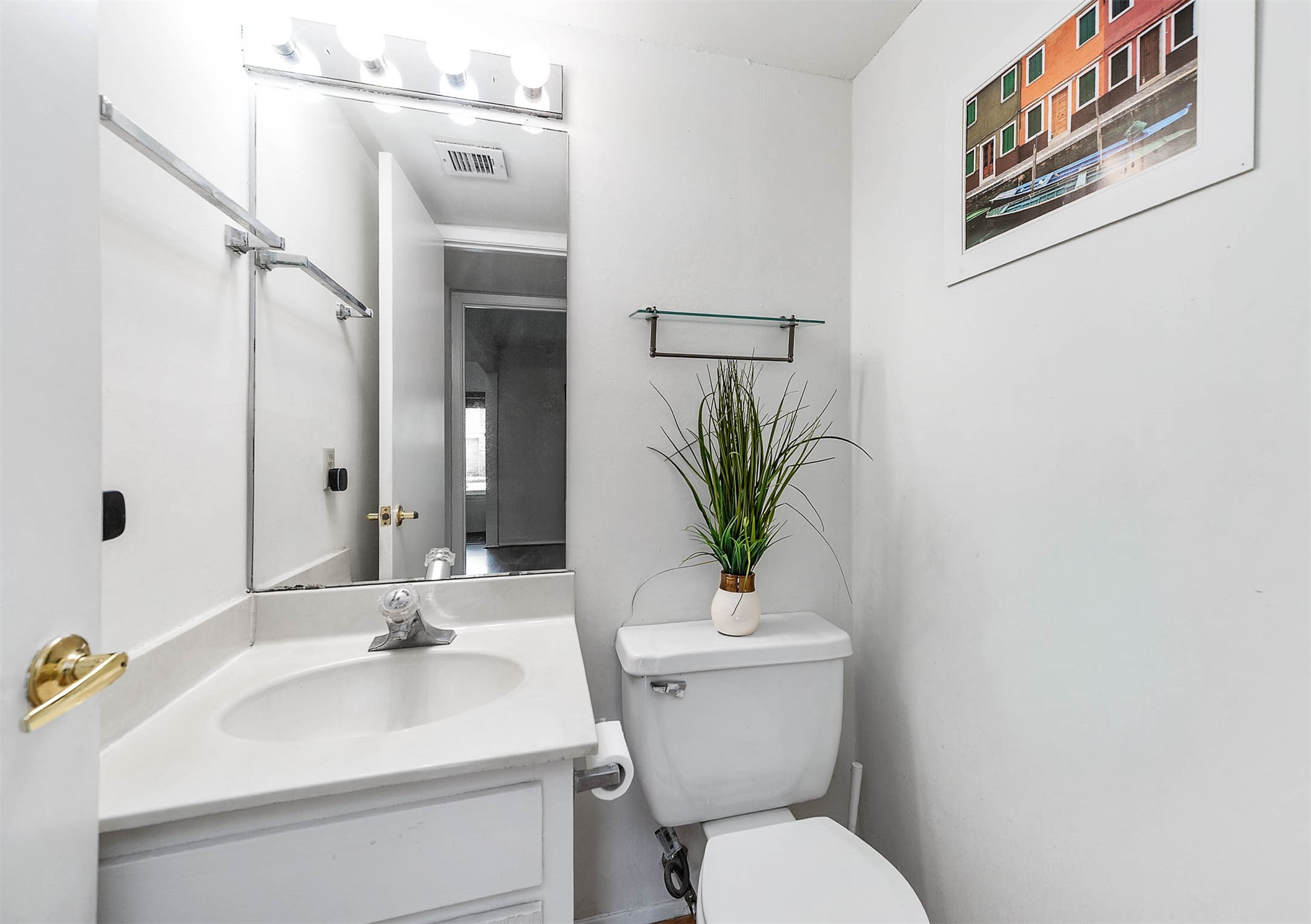 11609 Village Pl Drive Houston, TX 77077 - Photo 12 of 34 a bathroom with a toilet sink and mirror