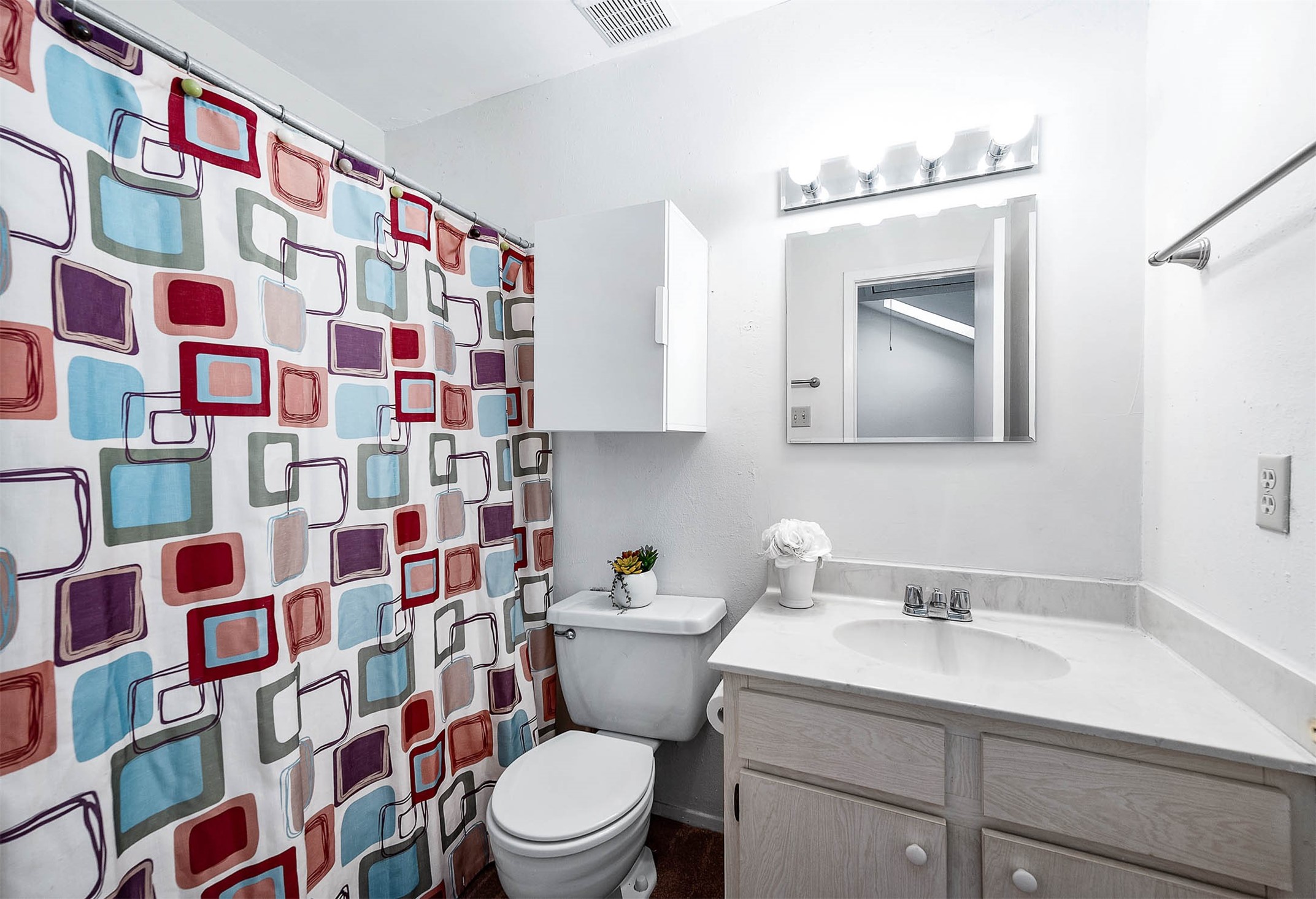 11609 Village Pl Drive Houston, TX 77077 - Photo 25 of 34 a bathroom with a sink and a mirror