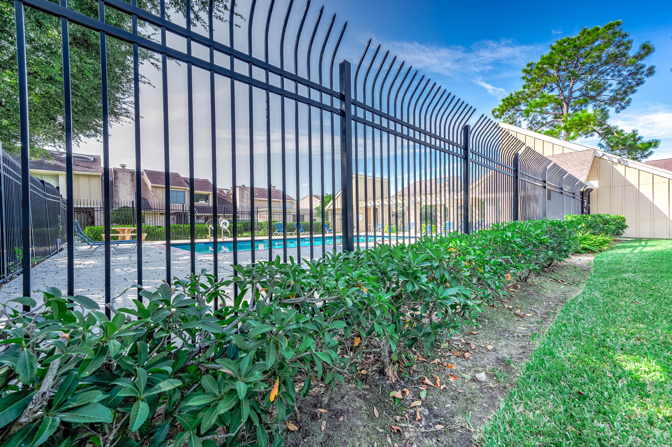 11609 Village Pl Drive Houston, TX 77077 - Photo 32 of 34 a view of a backyard with a garden