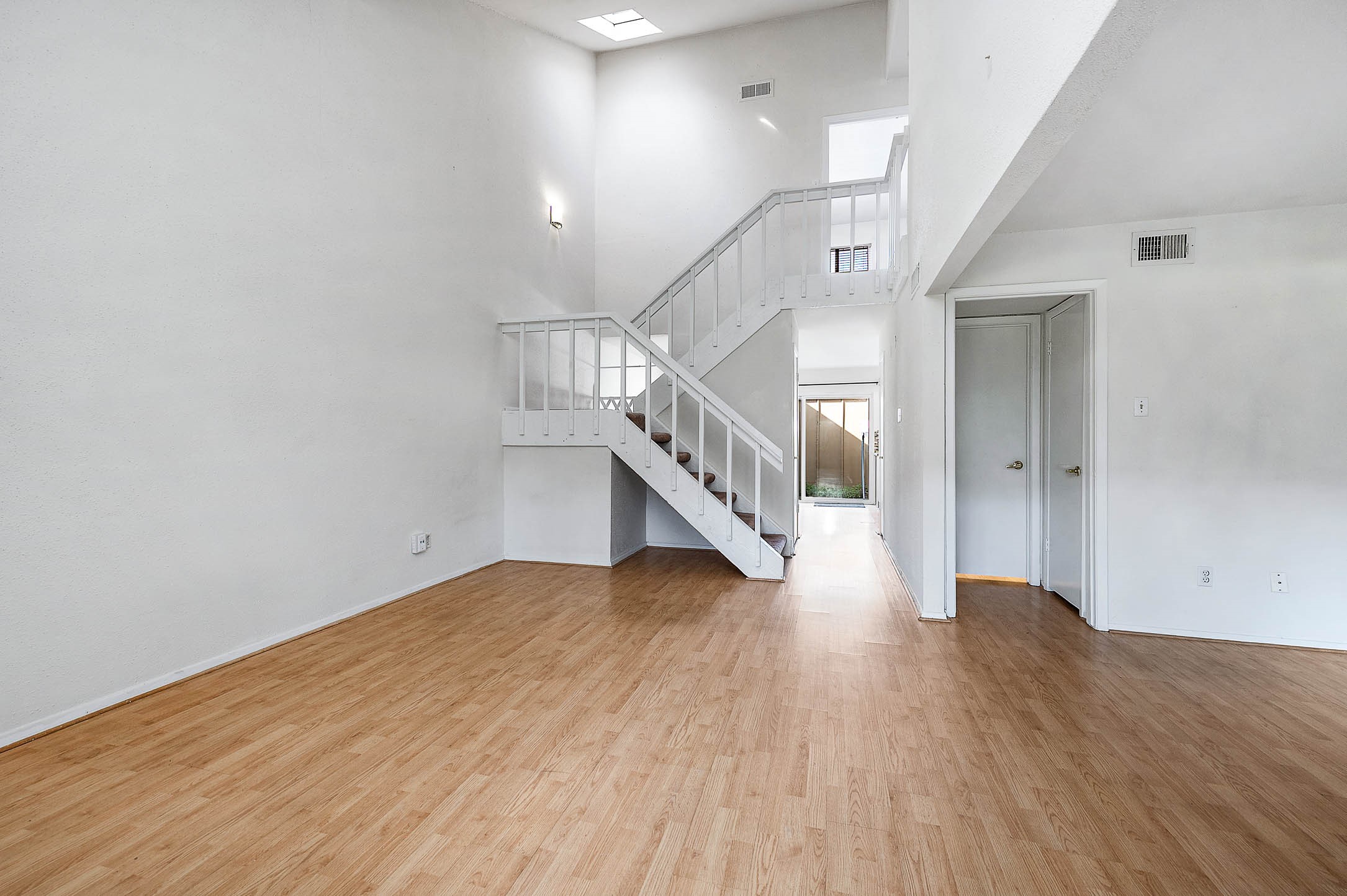 11609 Village Pl Drive Houston, TX 77077 - Photo 6 of 34 a view of a hallway with wooden floor