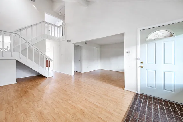 a view of an entryway with wooden floor