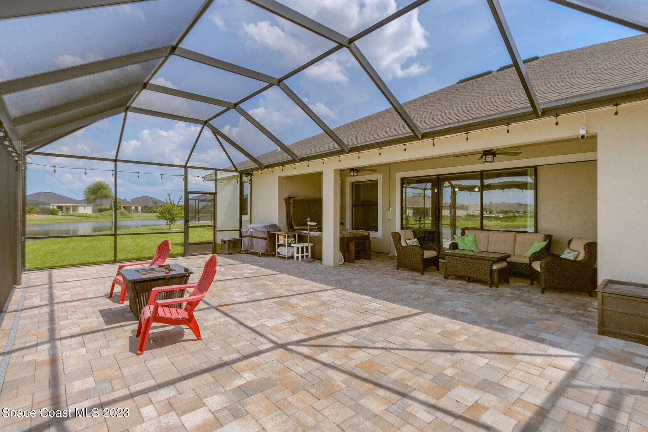 7729 Kerrington Drive Melbourne, FL 32940 - Photo 11 of 61 a building outdoor space with patio furniture and garden