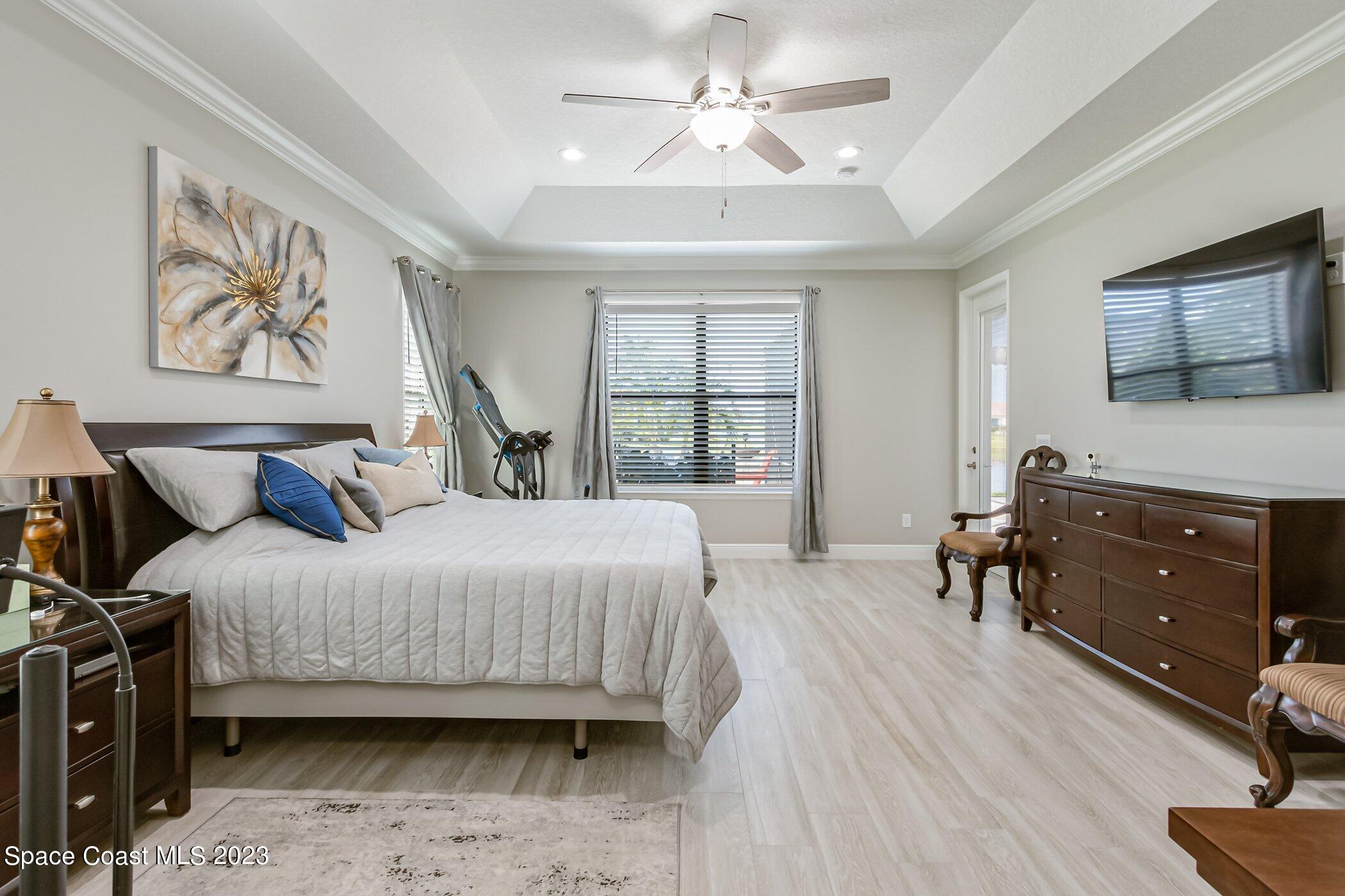 7729 Kerrington Drive Melbourne, FL 32940 - Photo 22 of 61 a bedroom with a bed and a window