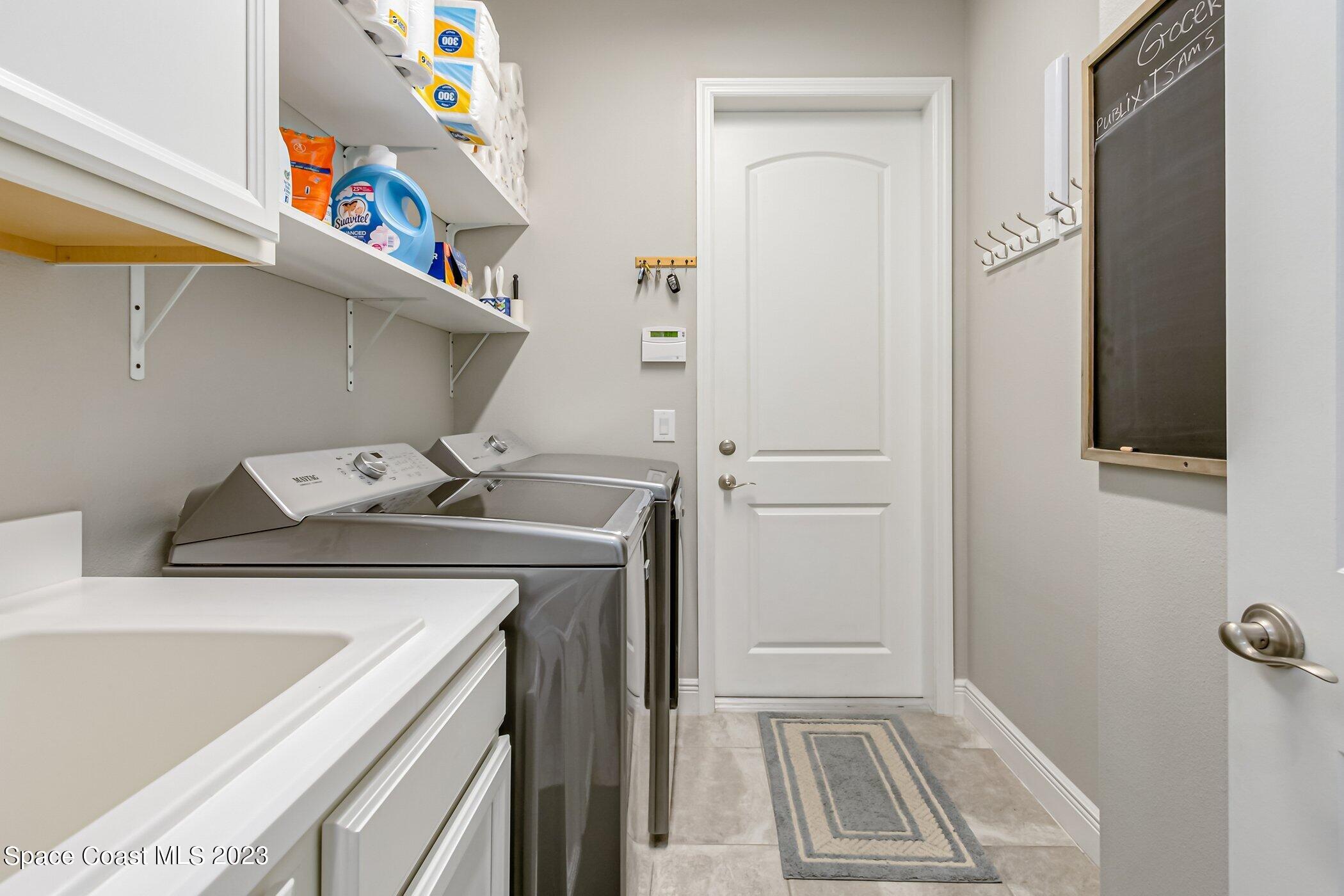 7729 Kerrington Drive Melbourne, FL 32940 - Photo 24 of 61 a view of utility room