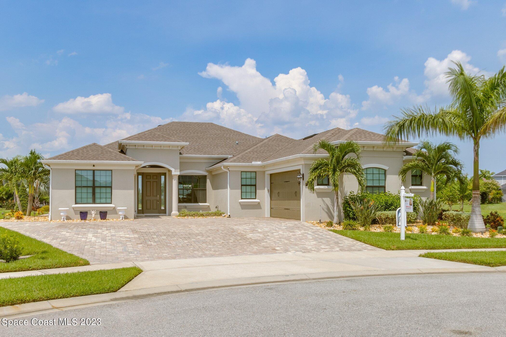 7729 Kerrington Drive Melbourne, FL 32940 - Photo 4 of 61 front view of a house with a yard