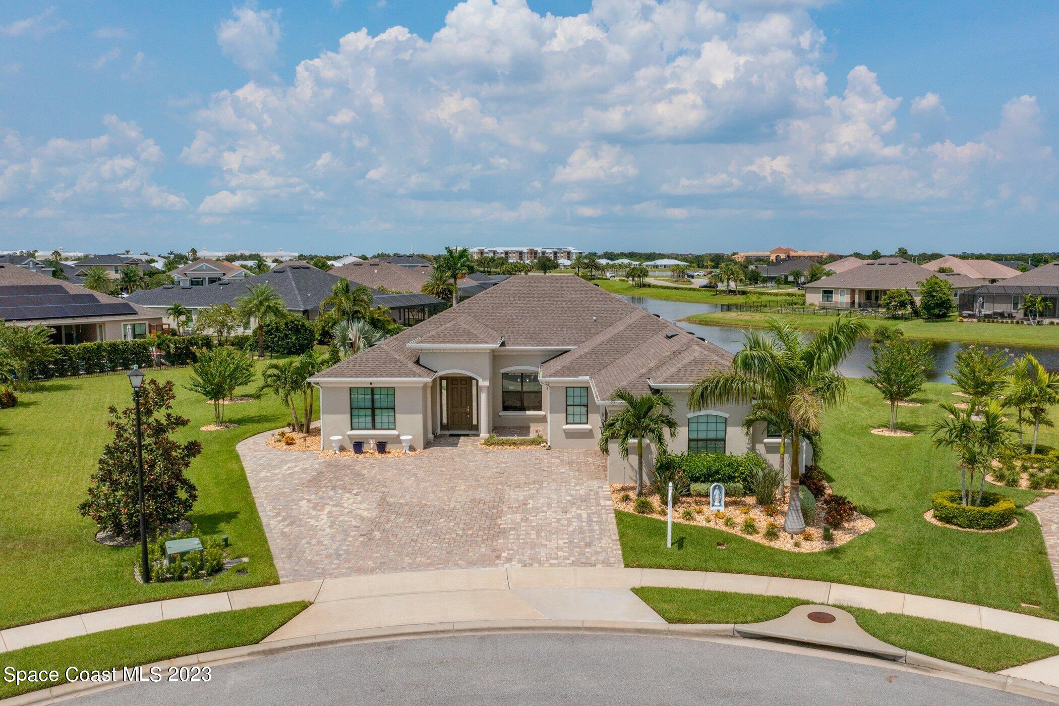 7729 Kerrington Drive Melbourne, FL 32940 - Photo 41 of 61 an aerial view of a house with a garden view