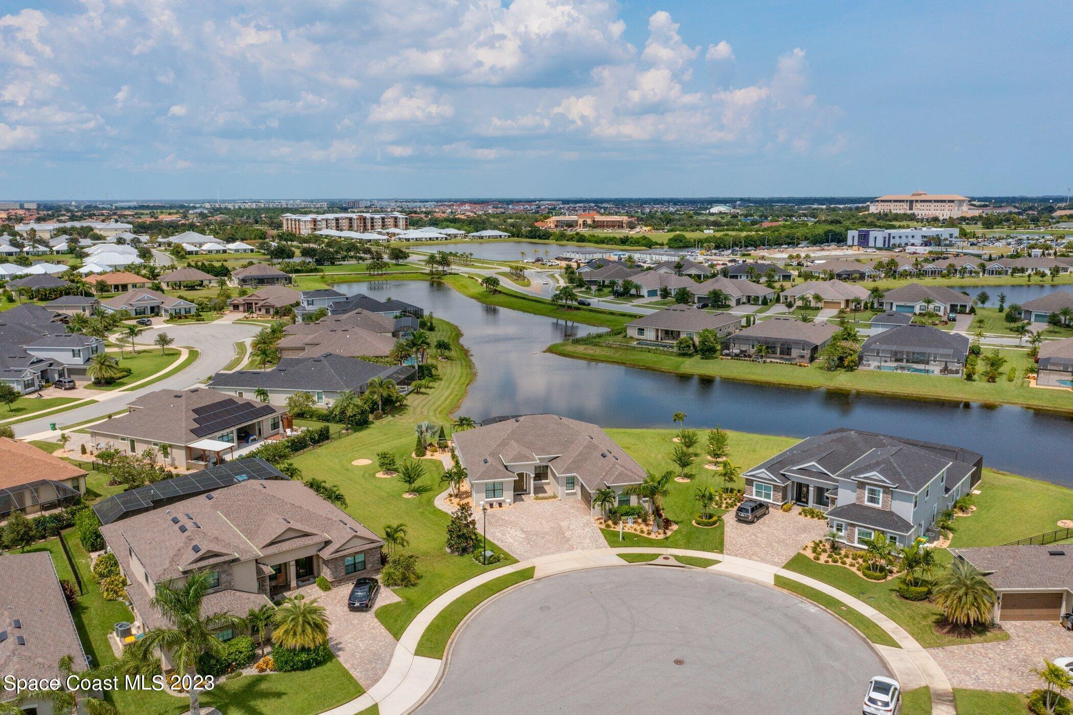 7729 Kerrington Drive Melbourne, FL 32940 - Photo 43 of 61 an aerial view of a house with a lake view