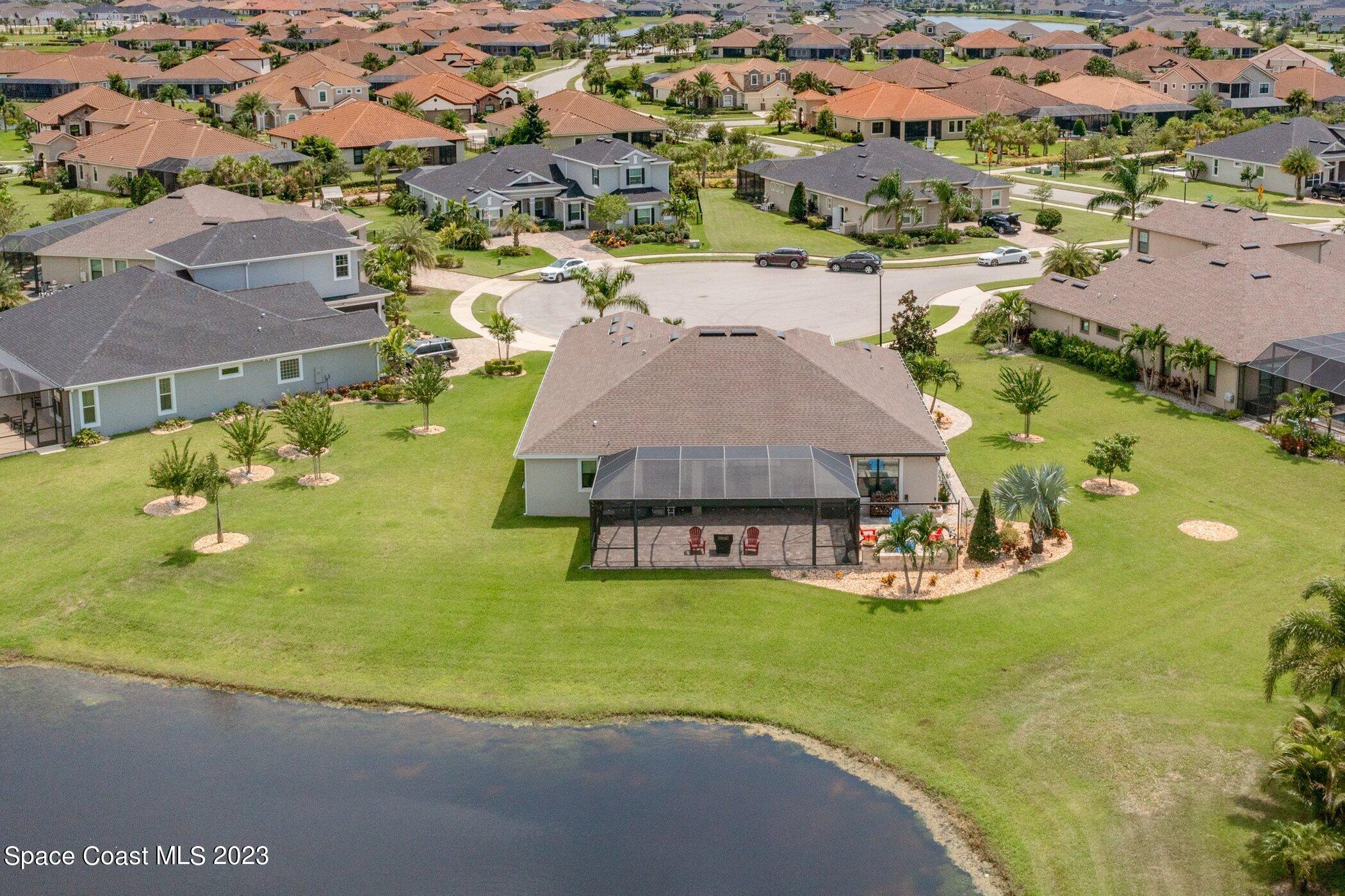 7729 Kerrington Drive Melbourne, FL 32940 - Photo 47 of 61 an aerial view of residential houses with outdoor space