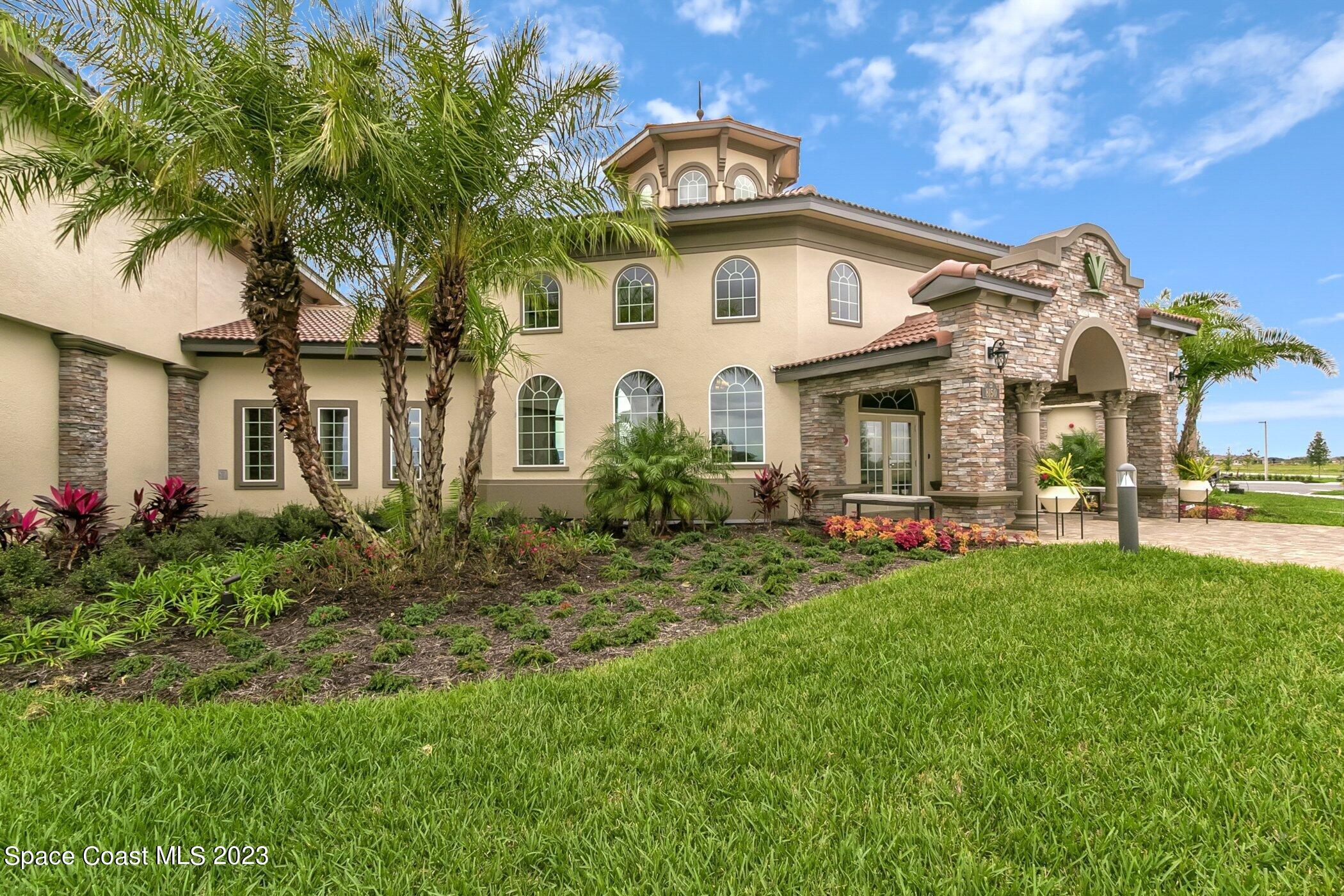 7729 Kerrington Drive Melbourne, FL 32940 - Photo 48 of 61 a view of a house with a yard