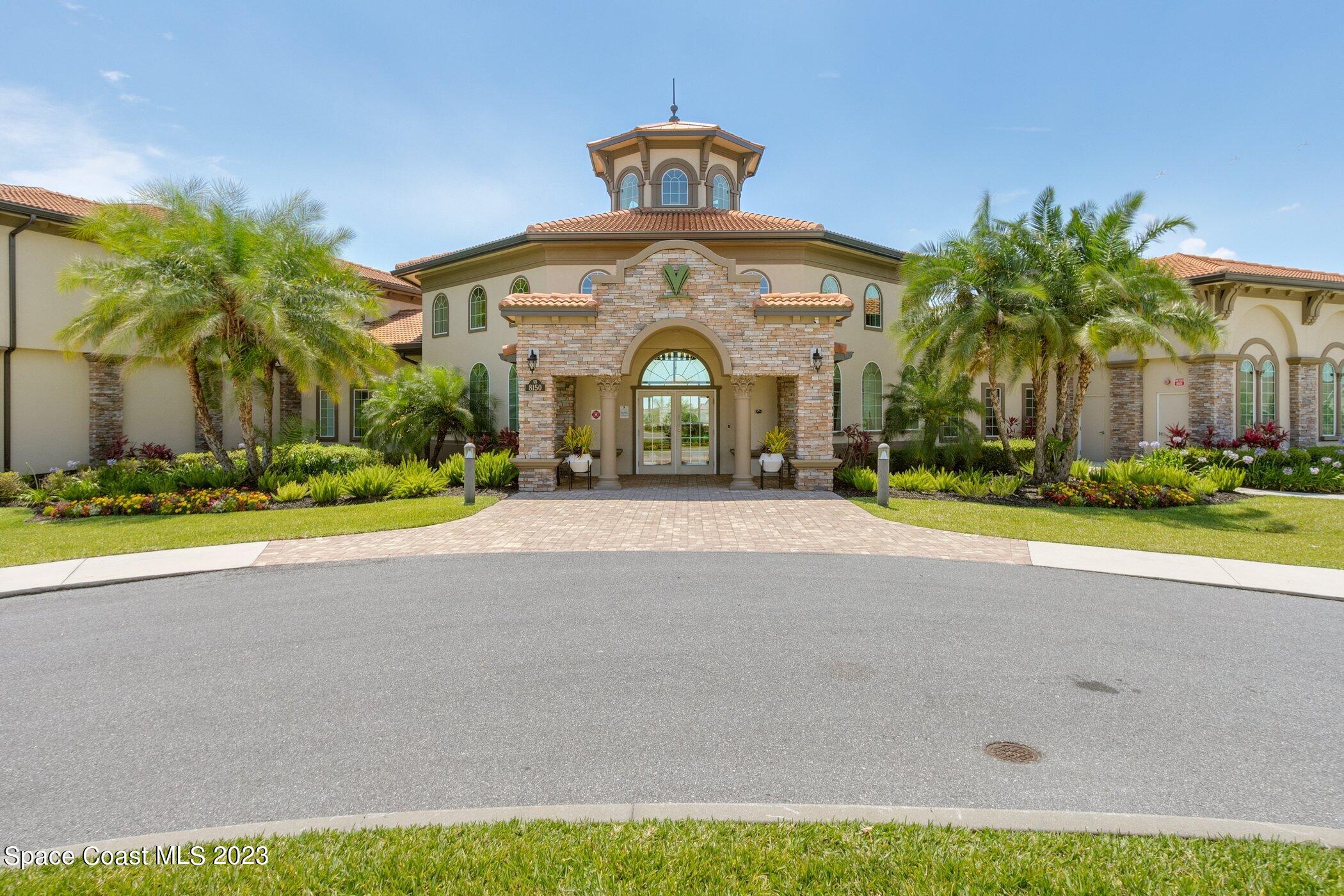 7729 Kerrington Drive Melbourne, FL 32940 - Photo 53 of 61 a front view of a house with a yard