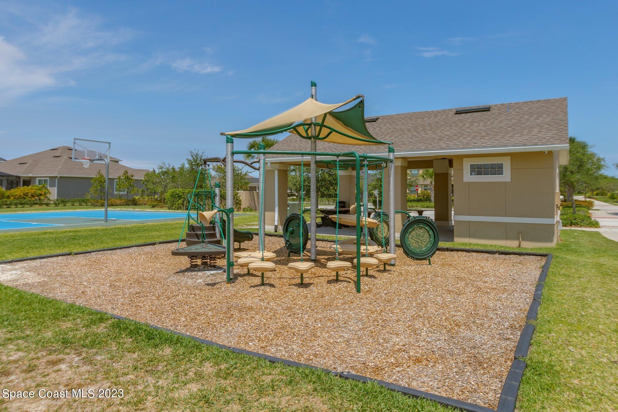 7729 Kerrington Drive Melbourne, FL 32940 - Photo 57 of 61 a view of a house with backyard porch and sitting area