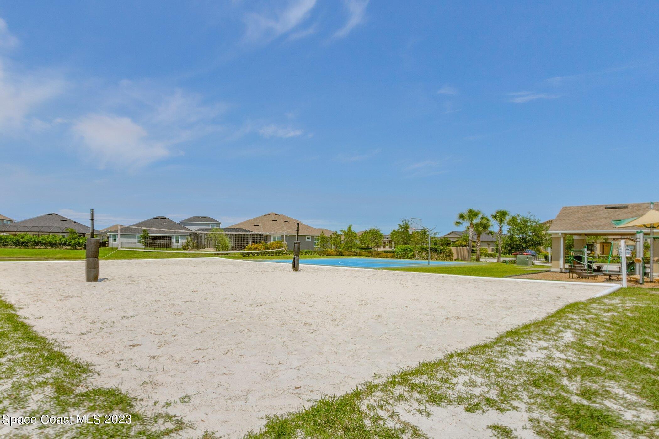7729 Kerrington Drive Melbourne, FL 32940 - Photo 58 of 61 a view of an ocean & house with a big yard