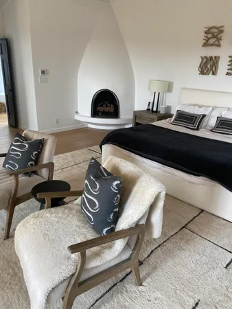 a living room with furniture and a mirror