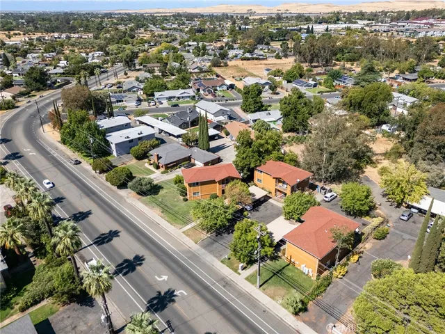 an aerial view of residential houses with outdoor space