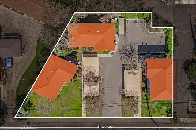 an aerial view of houses with outdoor space