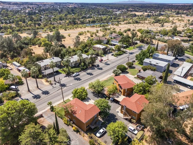 an aerial view of a houses with a yard