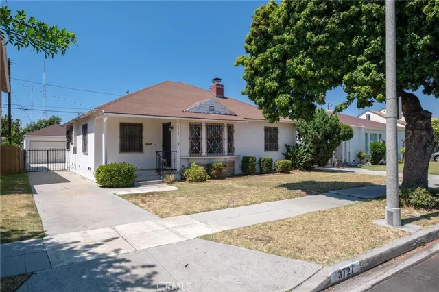 a front view of a house with yard