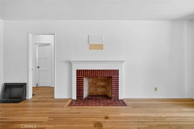 a view of fireplace with wooden floor