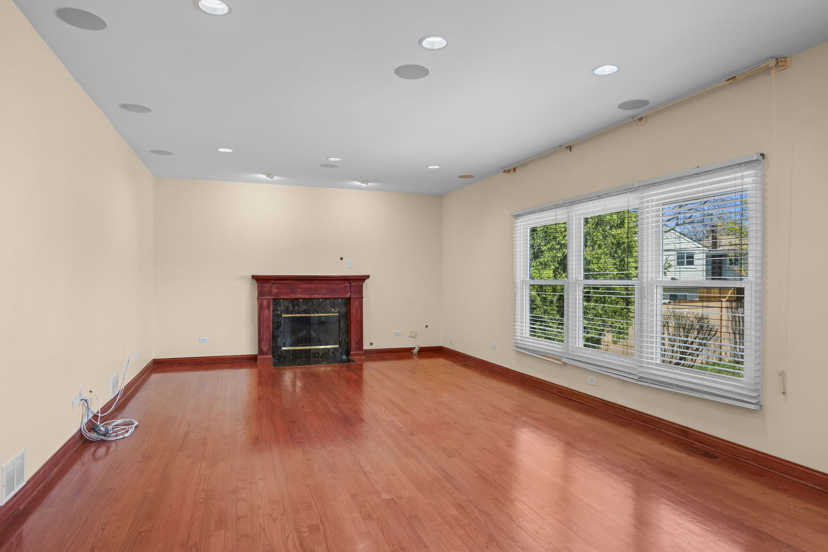 155 Lilac Lane Wheeling, IL 60090 - Photo 20 of 52 wooden floor in an empty room with a window