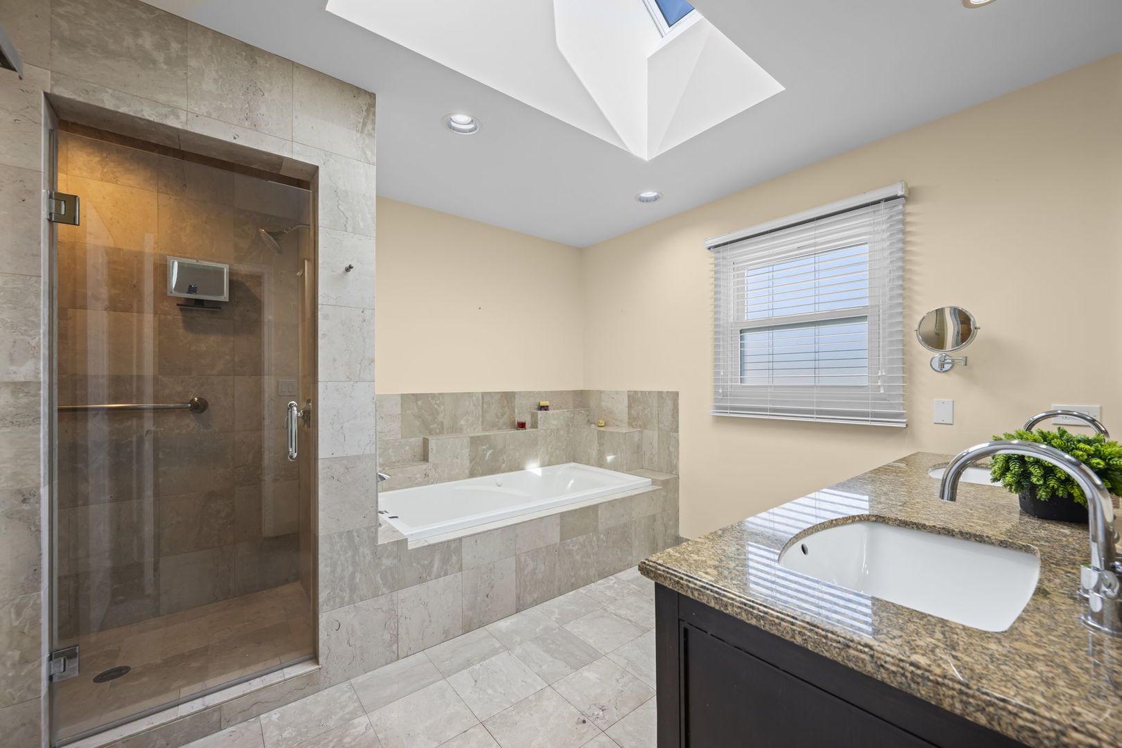 155 Lilac Lane Wheeling, IL 60090 - Photo 31 of 52 a bathroom with a granite countertop sink a bathtub and shower