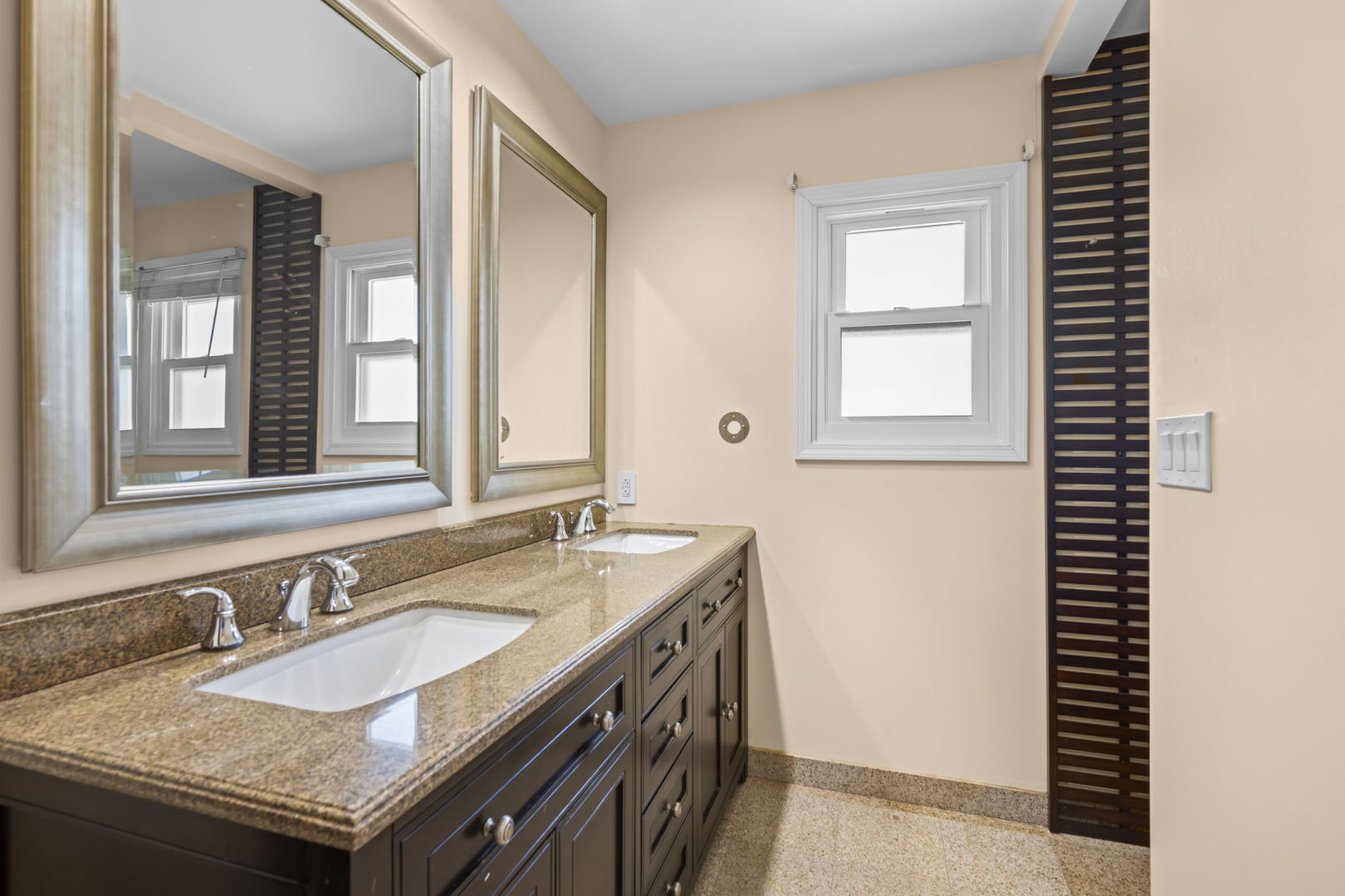 155 Lilac Lane Wheeling, IL 60090 - Photo 38 of 52 a bathroom with a granite countertop sink and a mirror