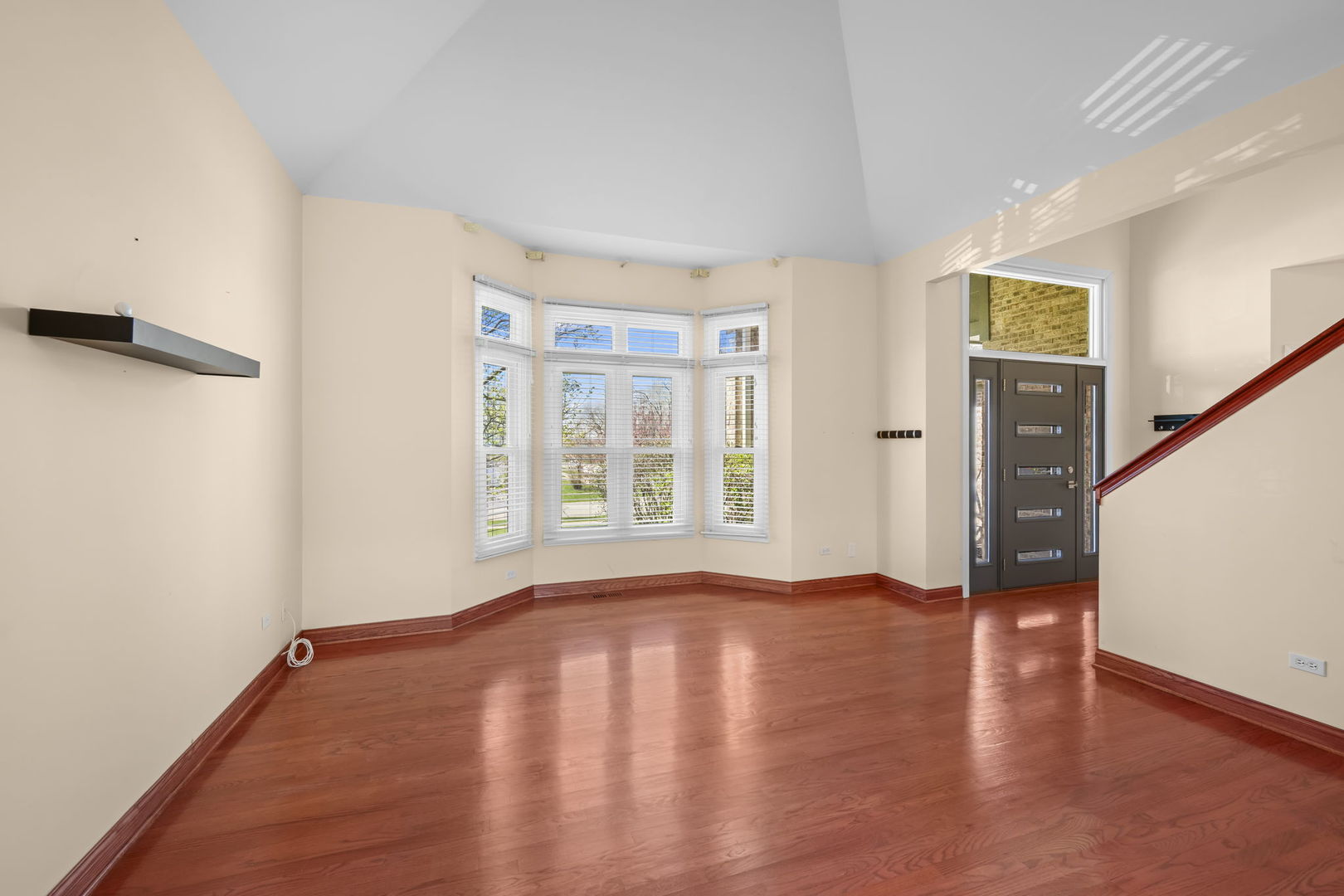 155 Lilac Lane Wheeling, IL 60090 - Photo 4 of 52 a view of an empty room with window and wooden floor